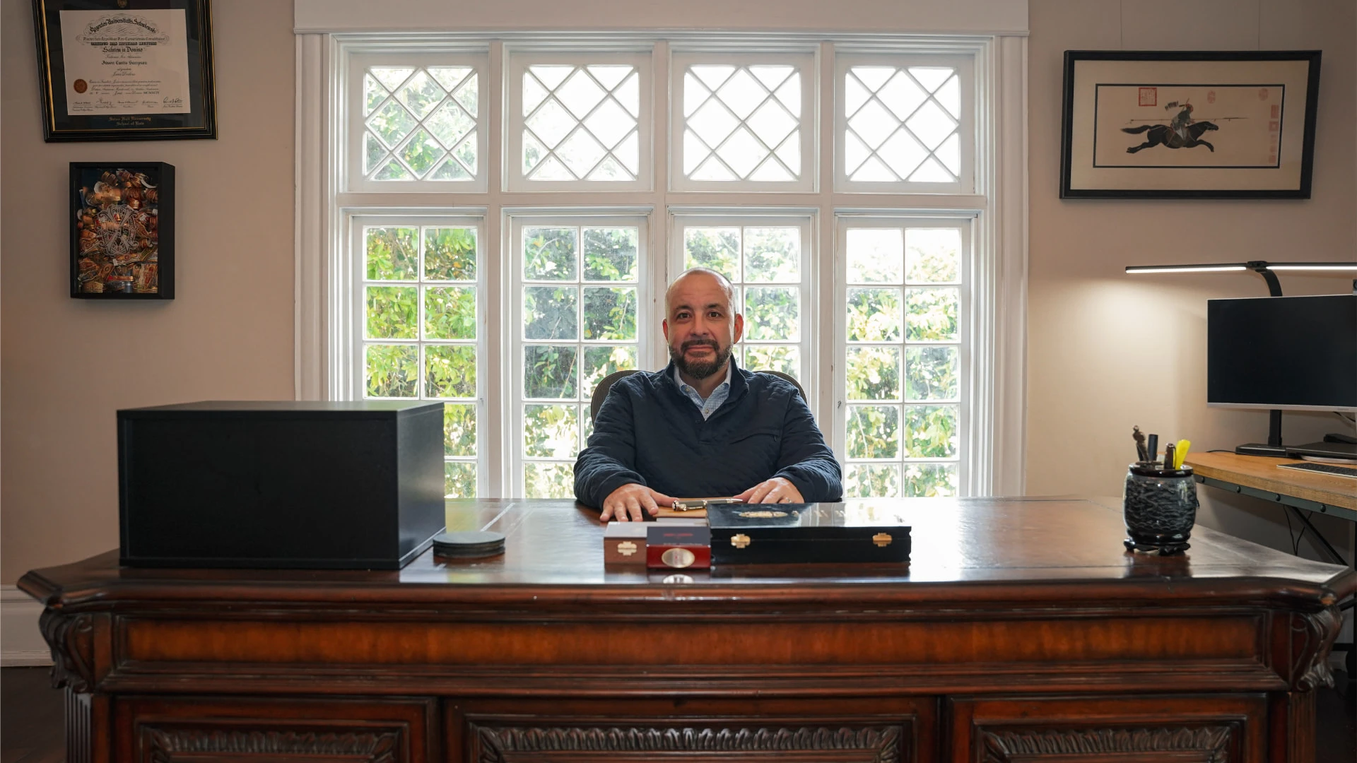 jason in his office table